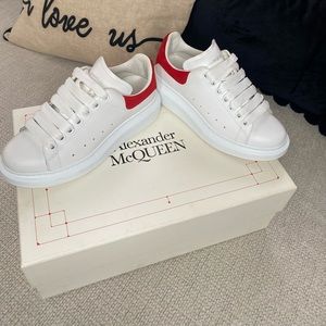 Alexander Mcqueen size 35 1/2 in women colors are lust red and white.